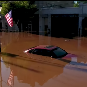 Image of car under water in the middle of a NJ town's main street